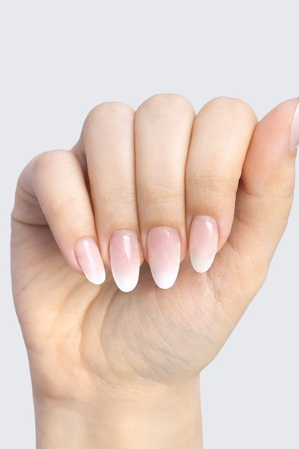pink white baby boomer fade on short almond nails
