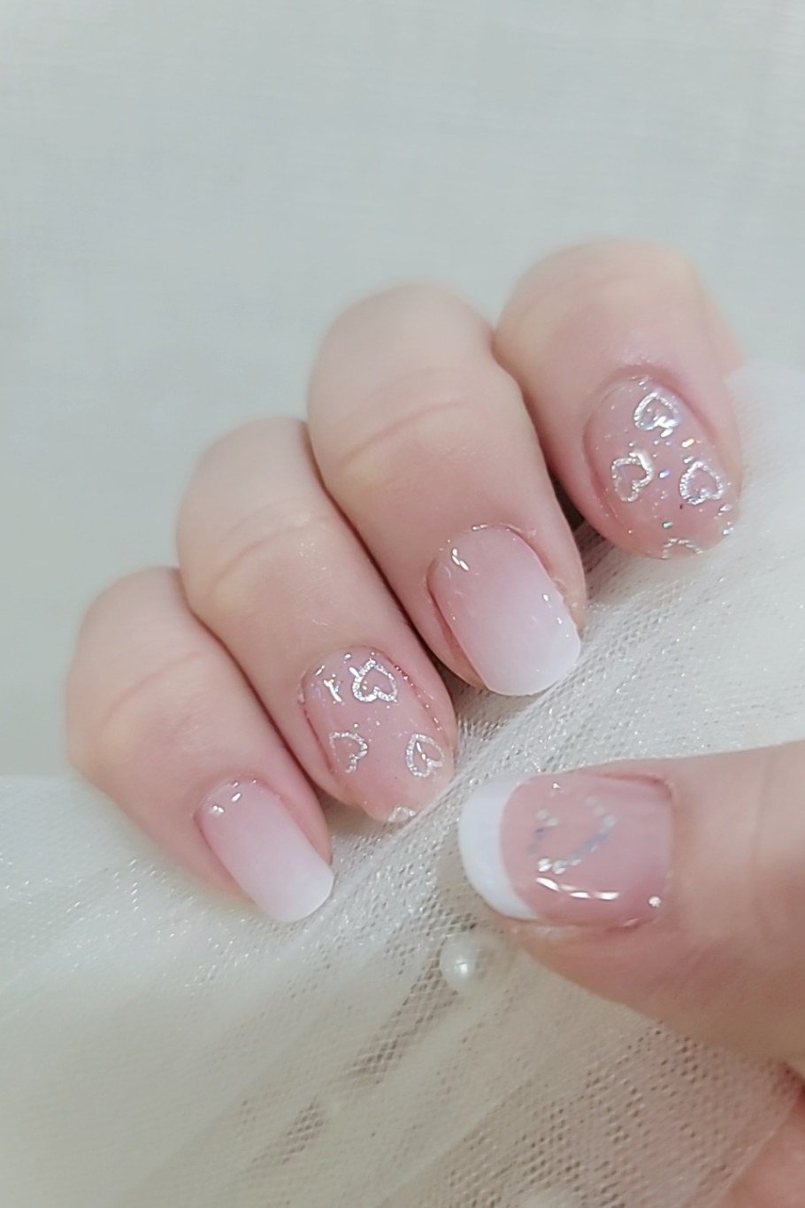 sheer pink short nails with tiny floral nail art