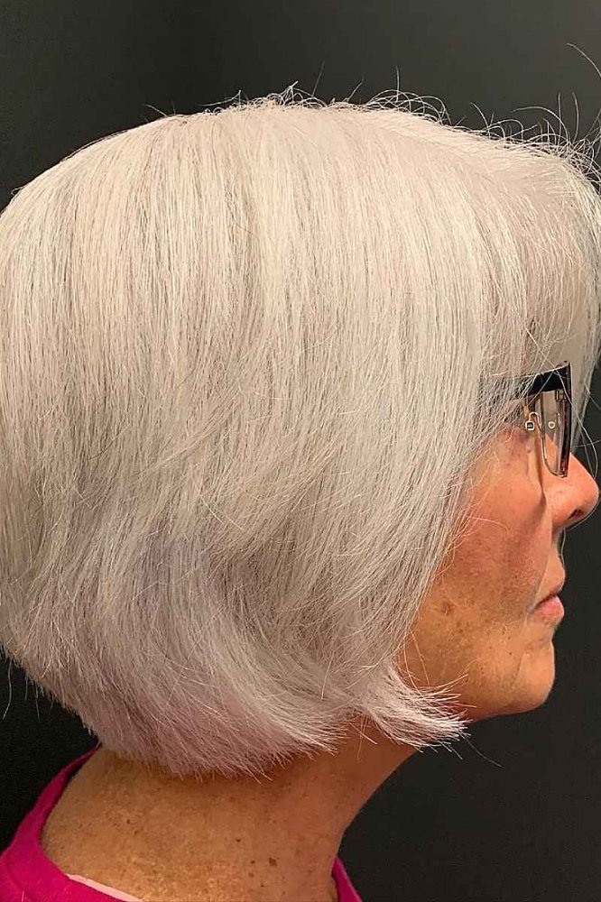 Crisp white rounded bob with a curved silhouette for women over 60