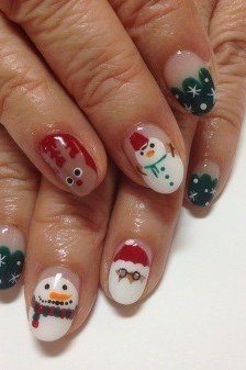 Mature hands, Santa and snowman face art with dark green and red nails - classy Christmas nail idea for women over 70