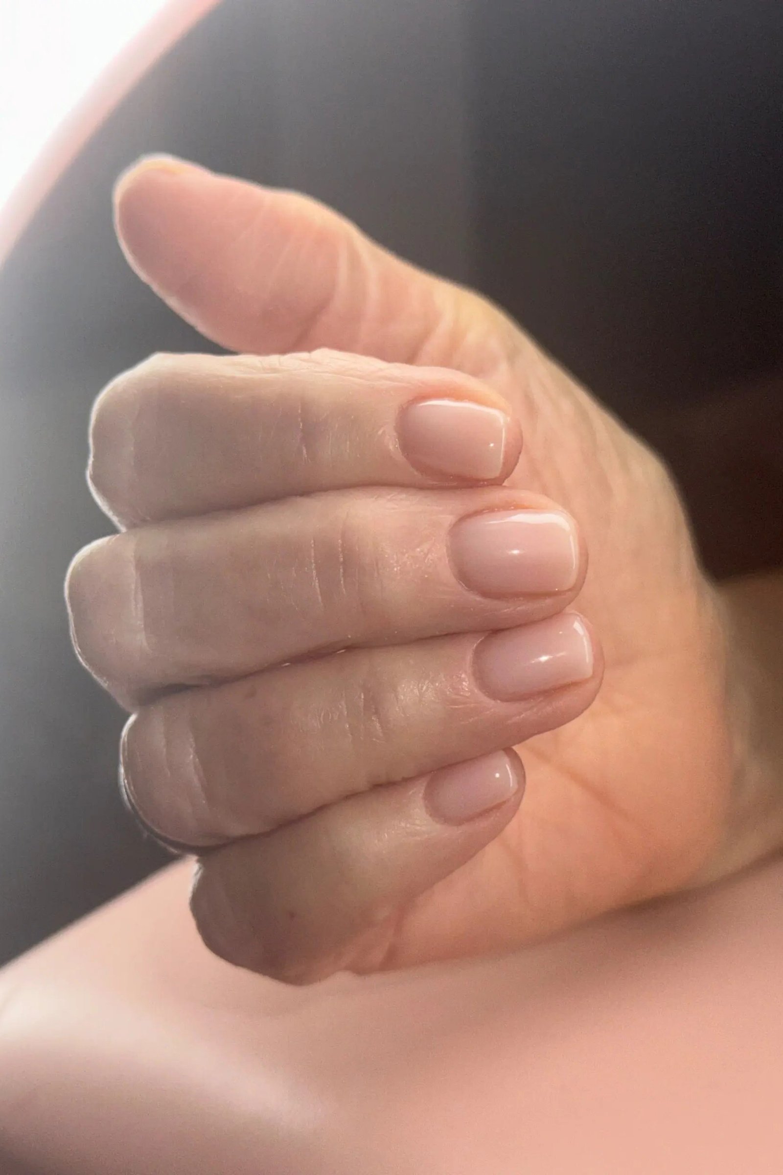 Simple nude short rounded nails for women over 50