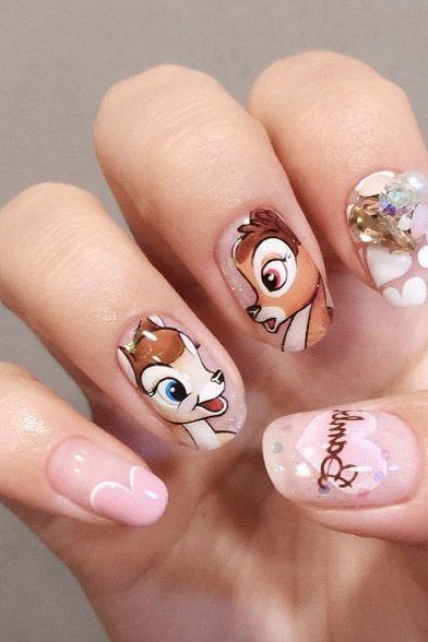 Pink nails with Bambi portraits and script accent nail fall design