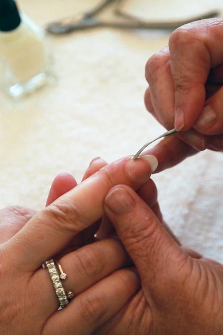 Cleaning under mature nails with a cuticle tool