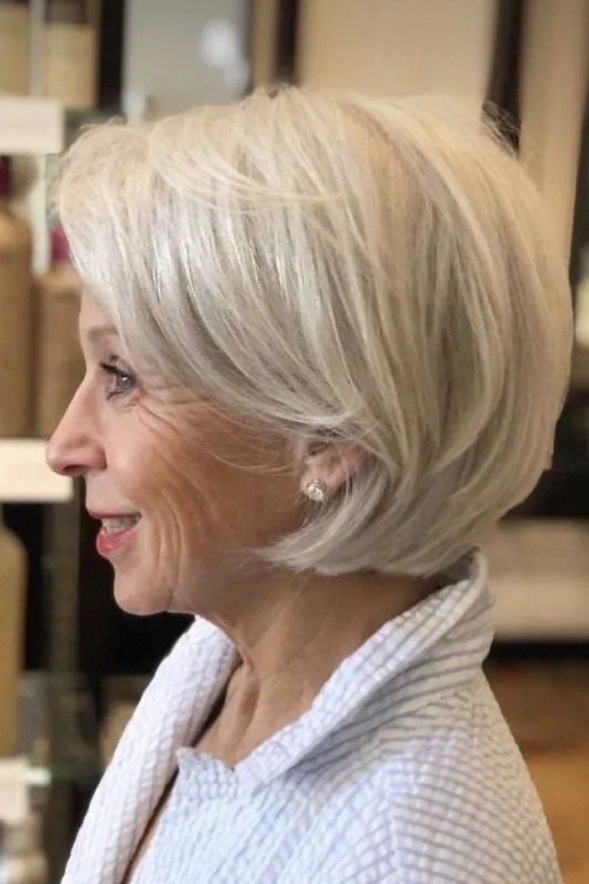 sleek straight silver bob, side profile, medium length hairstyle for women over 60