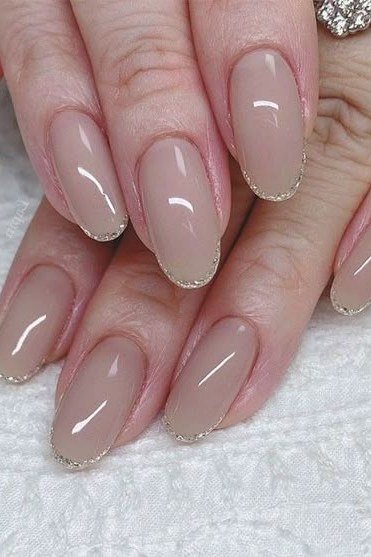 Taupe glossy nails on older hands, best manicure idea for women over 60