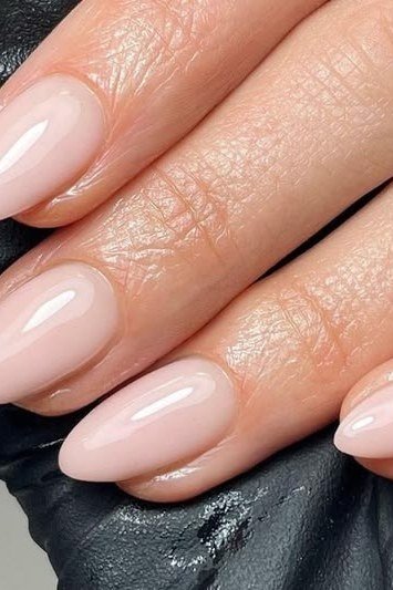 Pale Nude Beige Almond Mature Hands - elegant nude nail design for women over 60