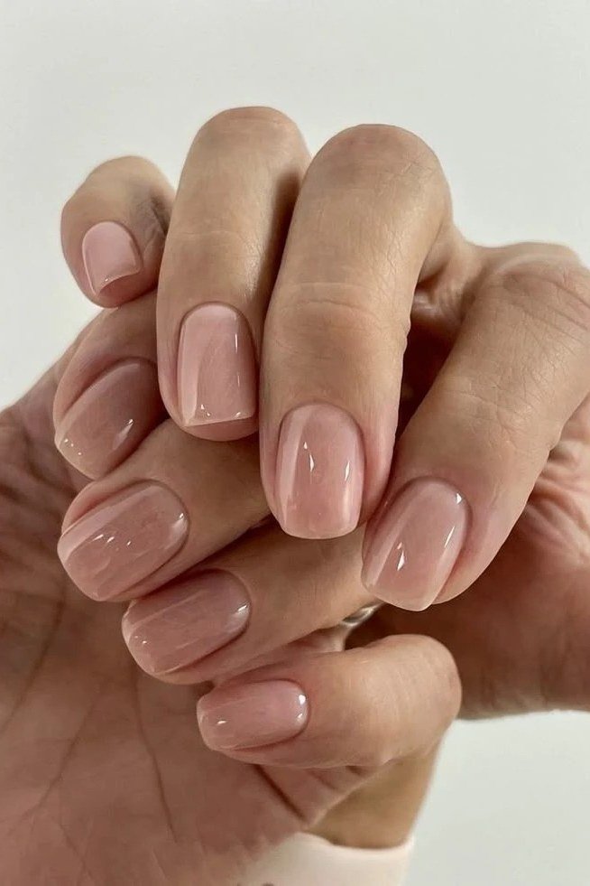 Warm Beige Nude, Hands Clasped - short nude nail idea for women over 50