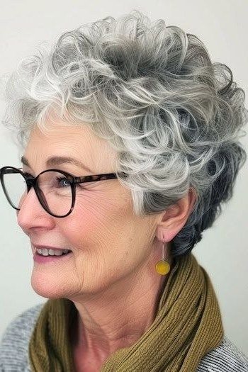 Silver curly bob front view with glasses, smiling - curly hairstyle for women over 60