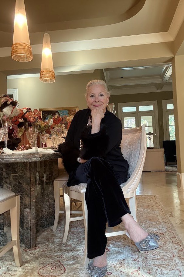 holiday evening outfit for women over 60: black velvet blazer with black trousers