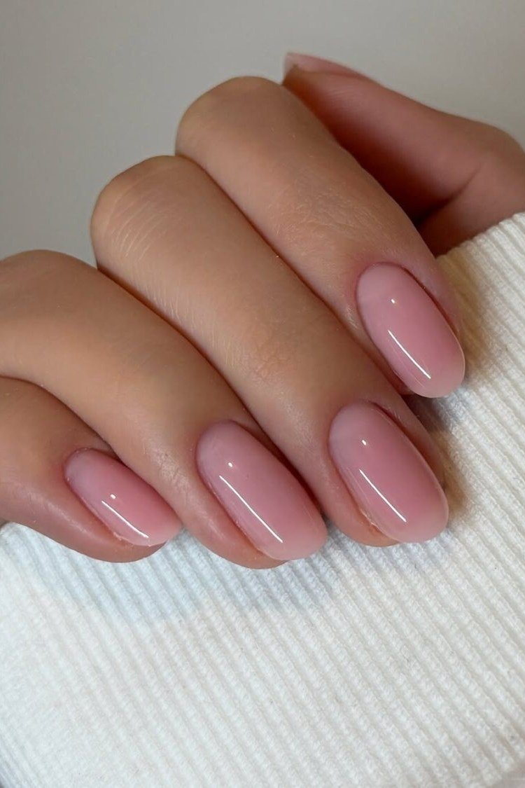Short oval pale sheer strawberry glaze nails