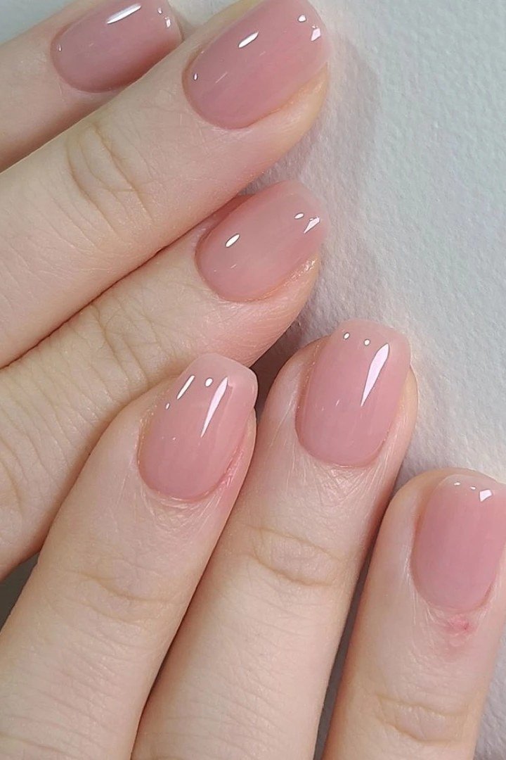 Sheer Pink Almond - short nail design for women over 60 that makes nails look longer