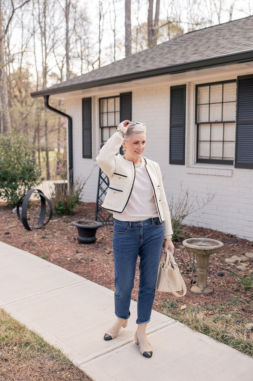 Cream Bomber Jacket with Dark Jeans on a woman over 50, fall outfit idea
