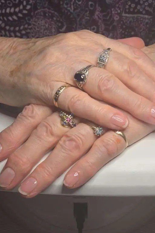 Pink nude nails with gold jewelry for women over 50