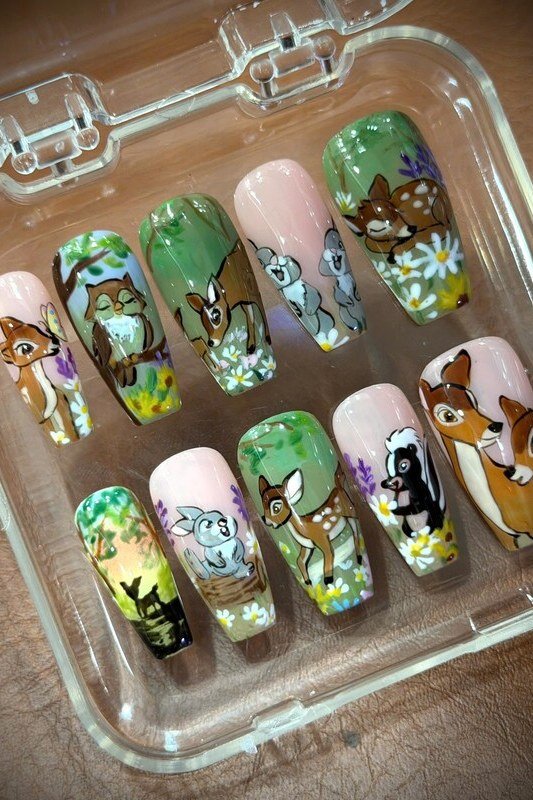 Bambi press-on nail set in case with green woodland character designs