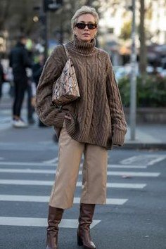 Brown cable-knit turtleneck with beige culottes and brown knee-high boots, polished weekend outfit for women over 40