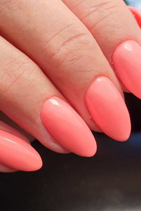 Bright coral almond nails glossy