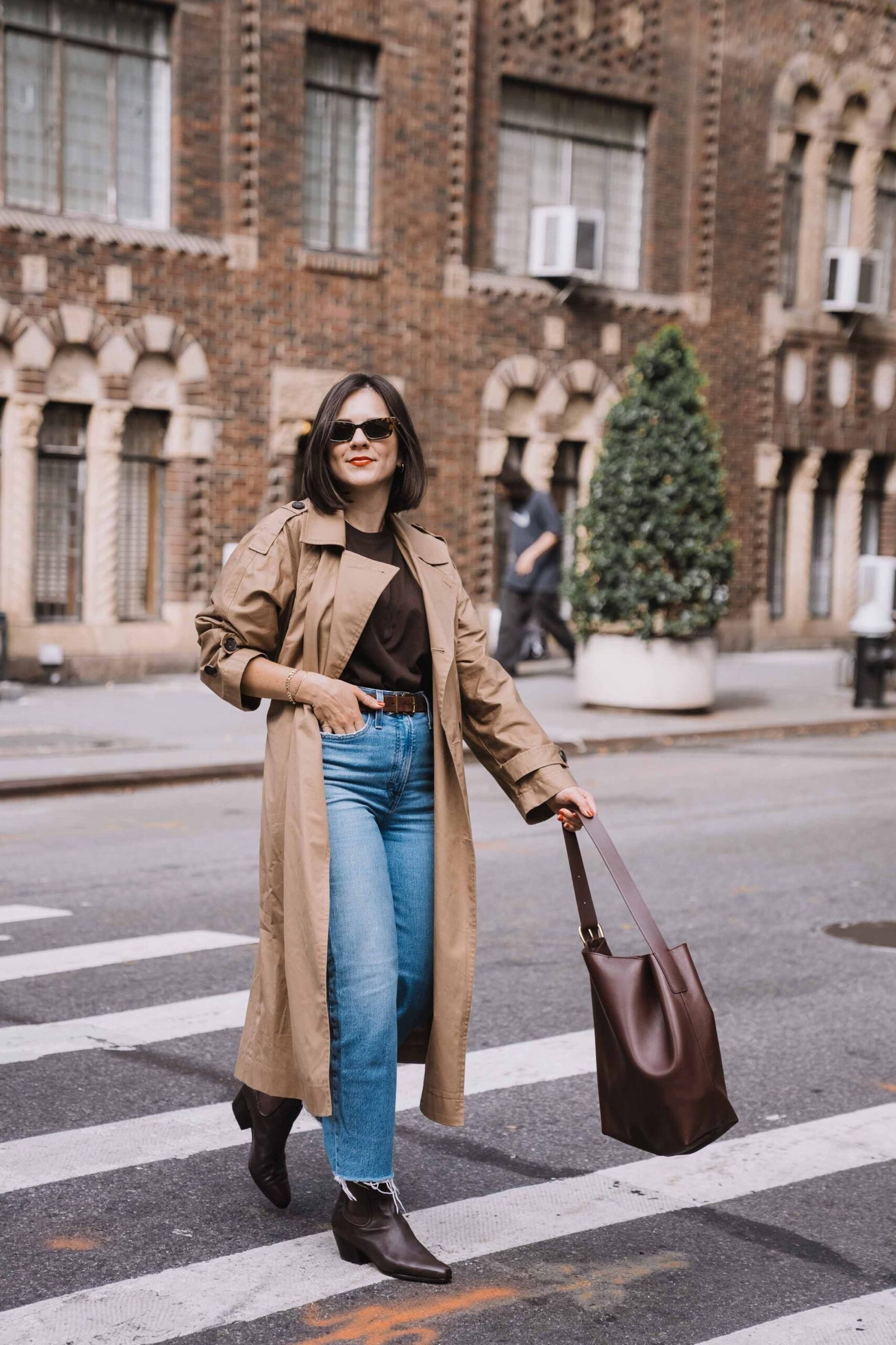 Tan trench coat with brown top blue jeans and ankle boots, fall outfit for women over 40