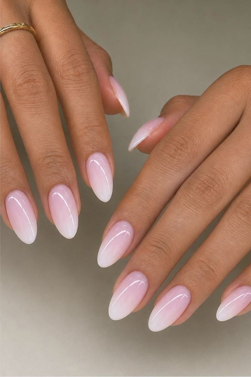 pink white baby boomer ombre on medium almond nails with rings