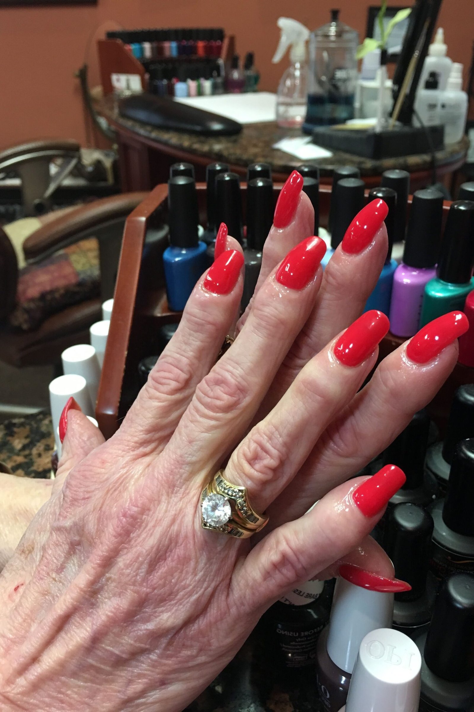 Bright Red Glossy Almond Nails for women over 60