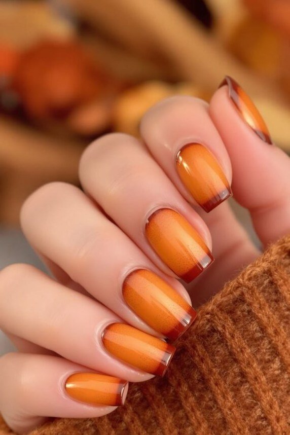 Amber Ombre on Round Nails - Golden amber deepens toward the tips on these short round nails, worn with a cozy knit sweater.