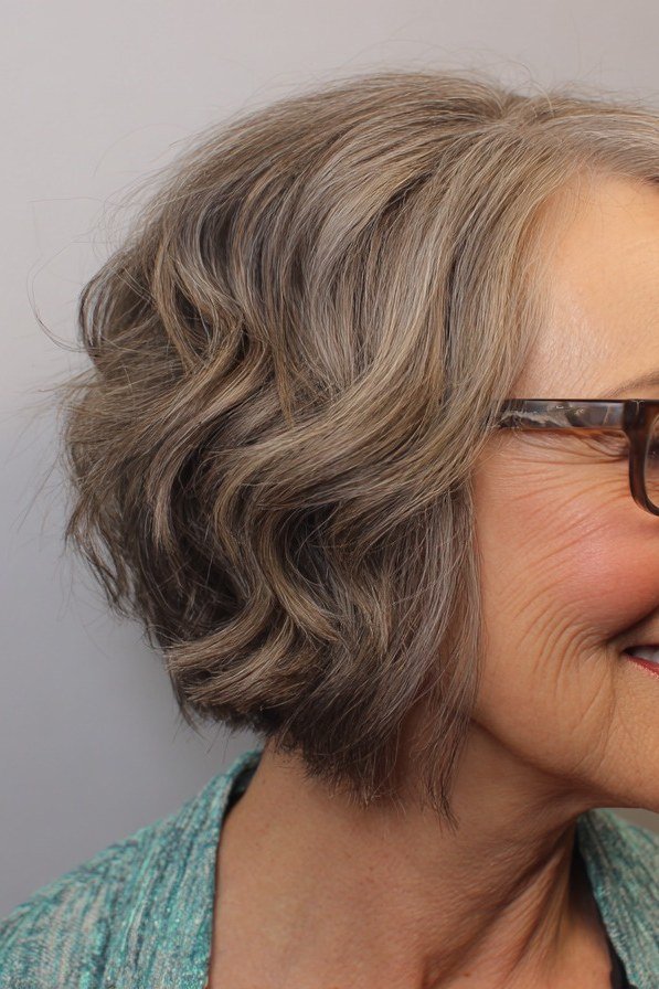Smiling Grey Bob with Glasses - short wavy bob hairstyle for women over 60