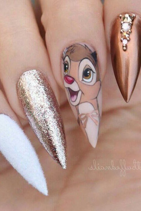 Long copper stiletto nails with Bambi portrait glitter and white accents