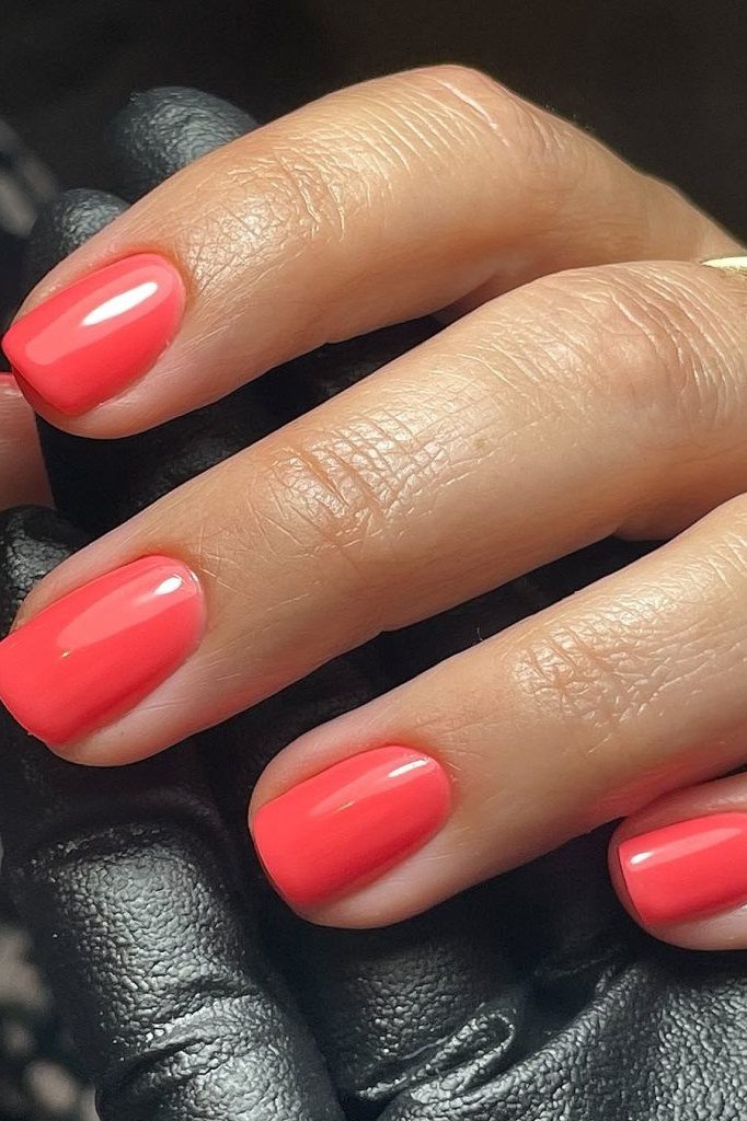 Coral red square nails with black glove