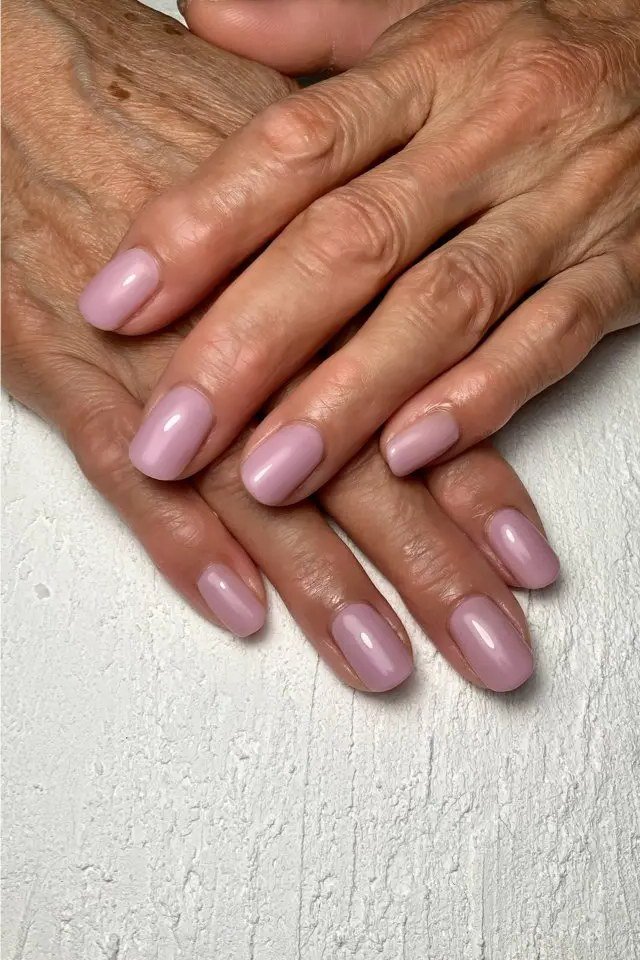 Classic pink gel nails for mature hands