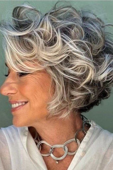 shoulder length salt and pepper wavy hair, front view