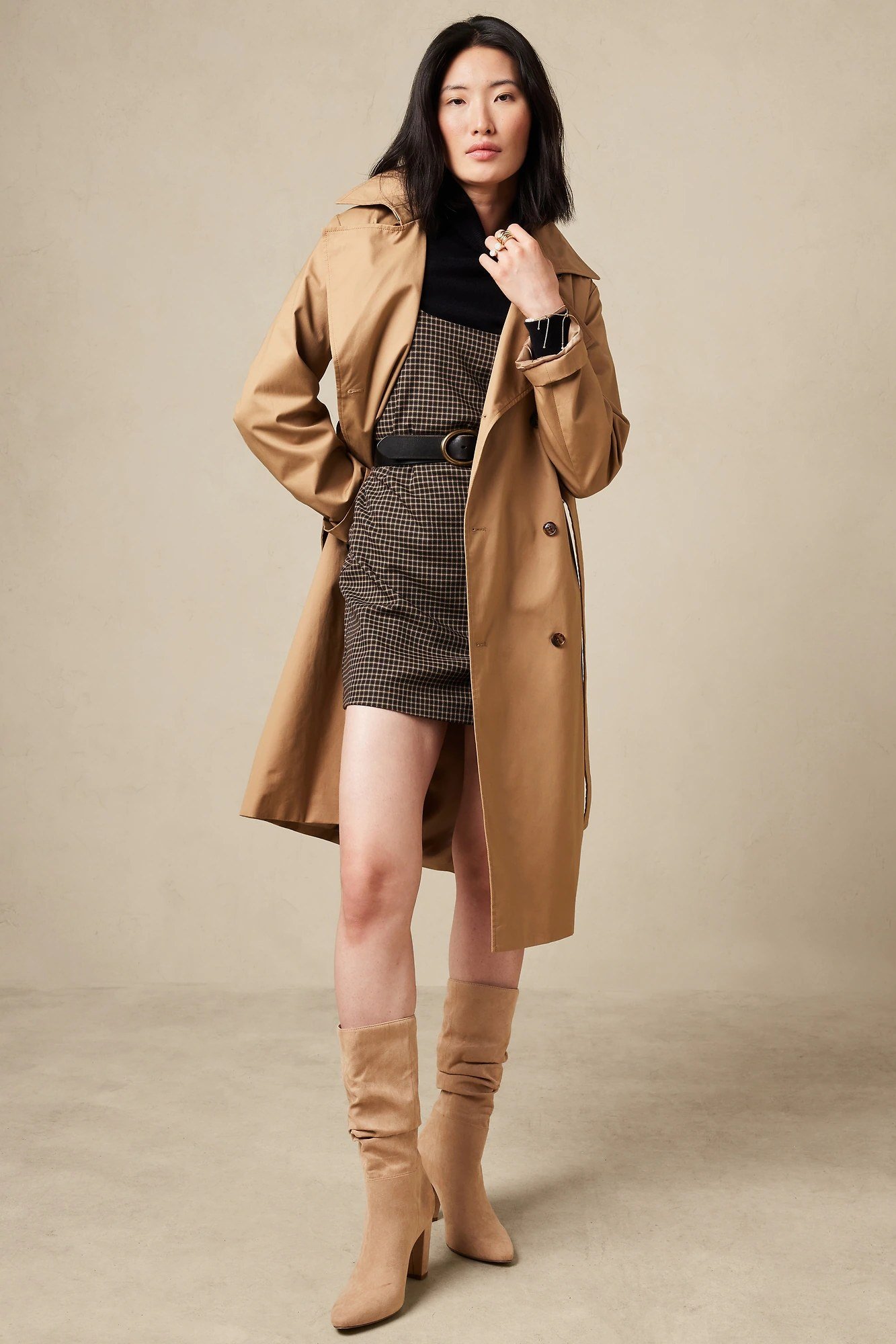 Camel coat with black turtleneck mini skirt and knee boots, trendy fall outfit for women over 40