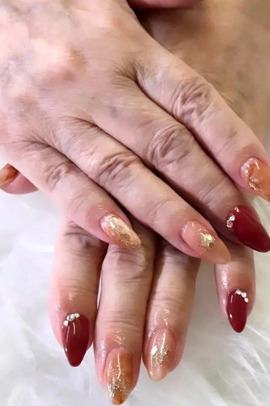 Burgundy with Gold Shimmer Ombre - fall nail color idea for women over 60