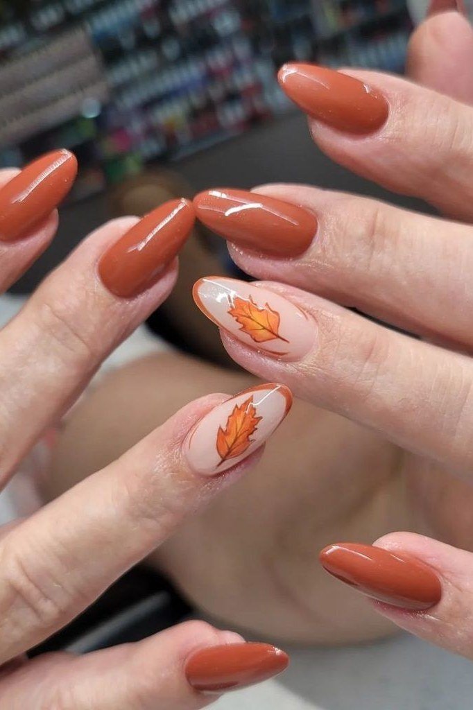 16. Terracotta Nails With a Single Leaf Accent - Thanksgiving nail art idea for women over 50