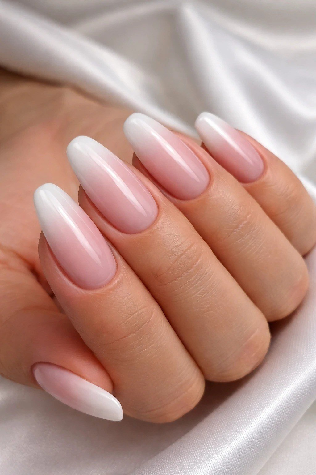 glossy pink white baby boomer ombre on almond nails