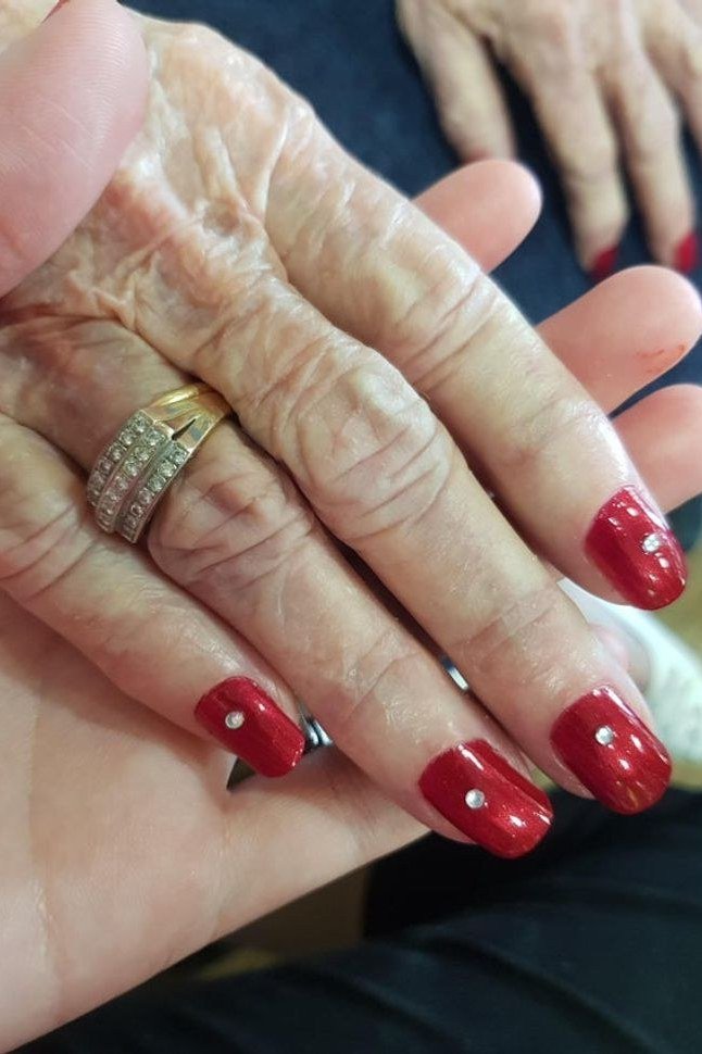 Red Nails with Gem Accents, nail color idea for women over 60