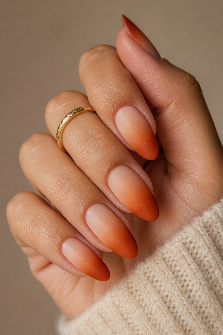 Amber Nude Gradient on Short Oval Nails - A soft nude base fades into warm amber tips on these short oval nails.