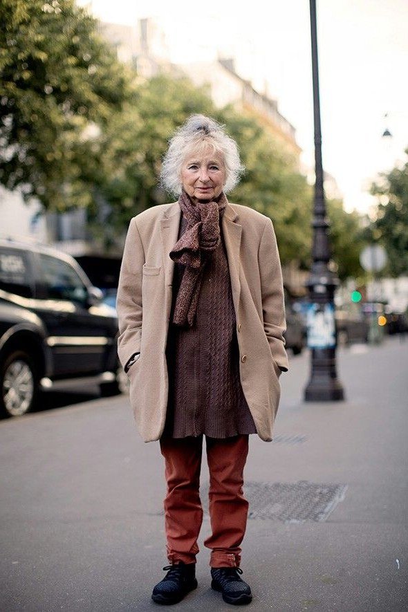 Elegant fall outfit for women over 70: camel coat with rust trousers