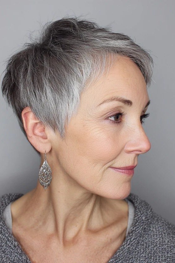 Salt-and-pepper pixie, profile view, micro pixie cut for women over 60 going silver