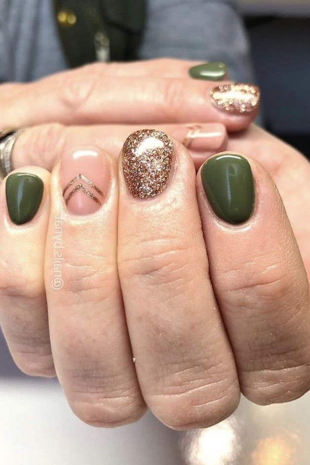 Forest Green Nails with Gold Glitter and a Chevron Accent, fall nail color idea for women over 50