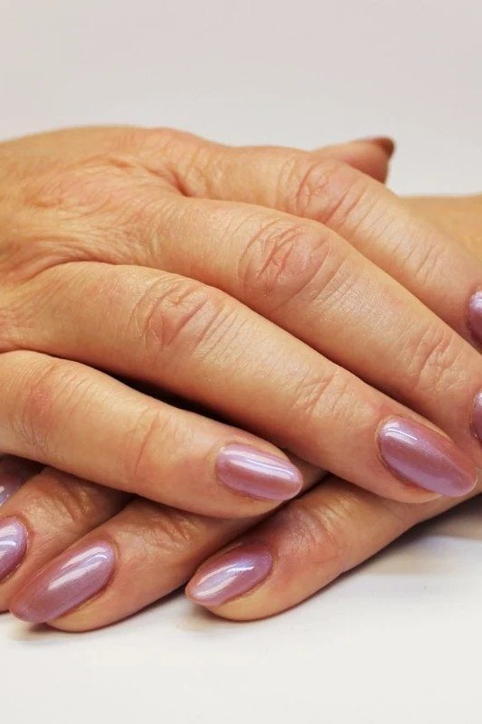mauve shimmer almond - winter nail trend for older women