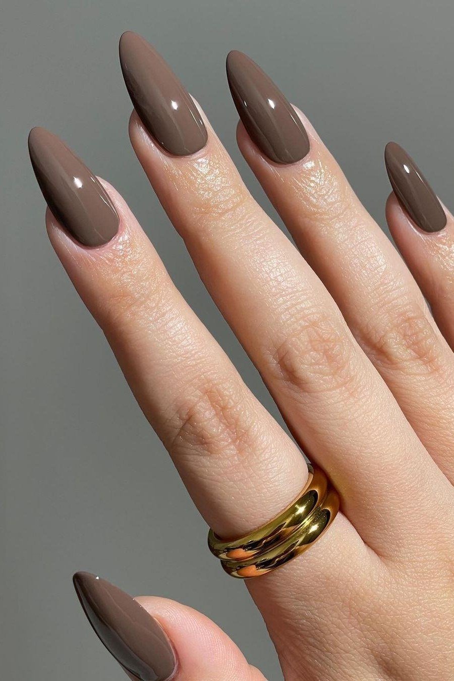 Glossy Taupe Almond Nails - brown nail idea for women over 50