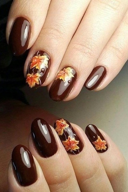 17. Chocolate Brown Nails With Maple Leaf Accents - Thanksgiving nail art idea for women over 50