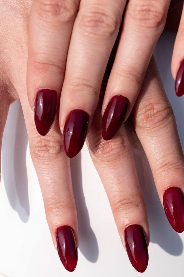 Deep Oxblood Glossy Almond Nails for women over 60