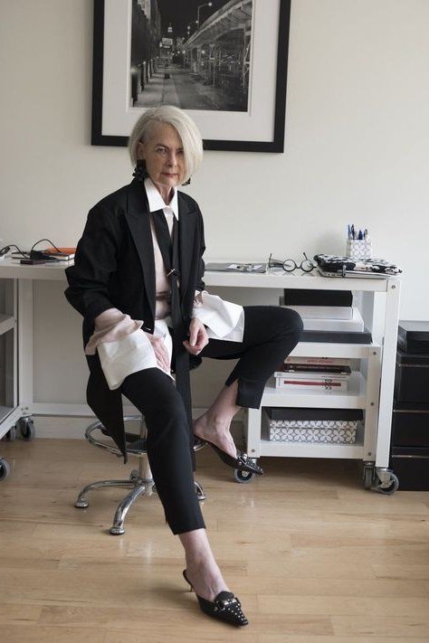Work outfit for women over 40: black blazer with white shirt and black trousers