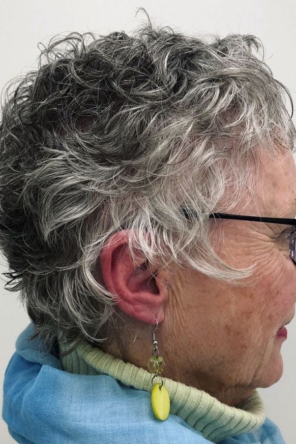 Curly gray crop haircut for women over 50