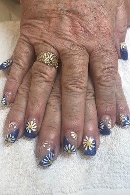 Cobalt Blue Nails with White Daisy Art - short nail design idea for women over 50