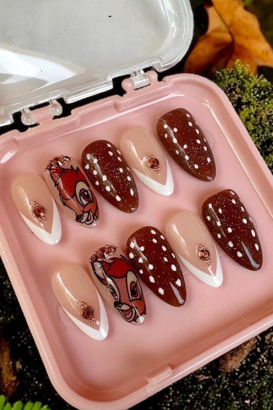 Red-brown spotted press-on nail set with Bambi faces in pink case