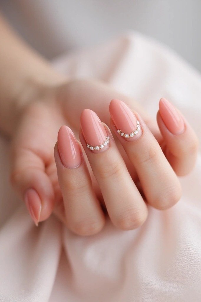 Pink oval nails with pearl lined tips