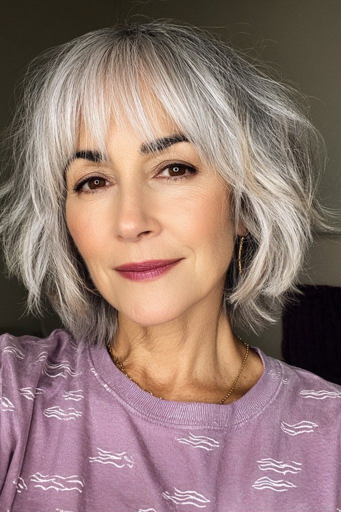 Silver shaggy layered bob with wispy bangs, front view, silver shaggy bob for women over 50