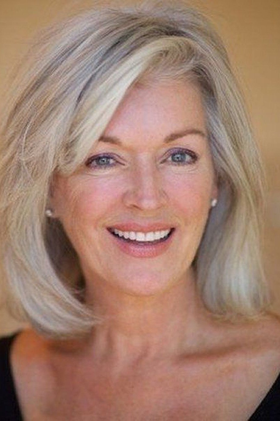 silver medium straight hairstyle, front view for women over 50