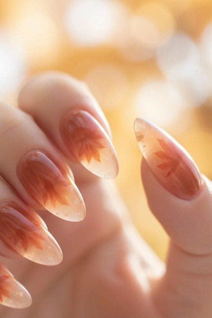 Amber ombre almond gel nails, glowing fall gradient manicure